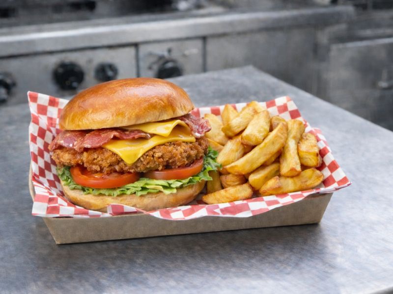 Crispy chicken and bacon sandwich with chips from KK Catering burger van.