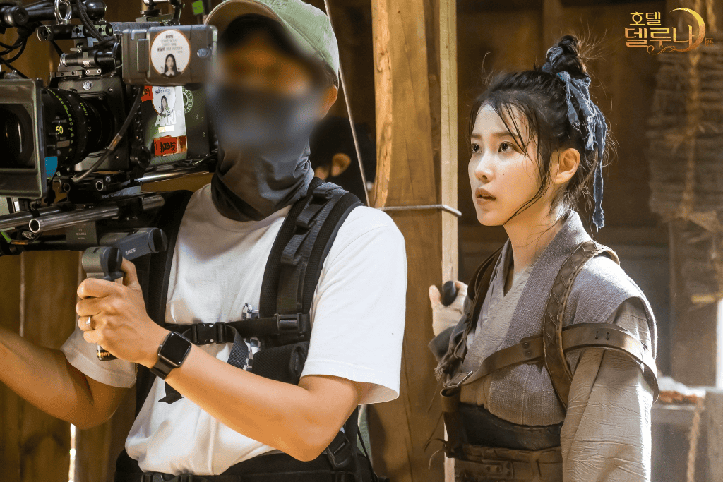 Korean drama filming set with cameras and actors.