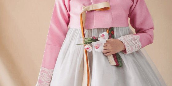 Close-up of hanbok embroidery with floral and crane patterns.
