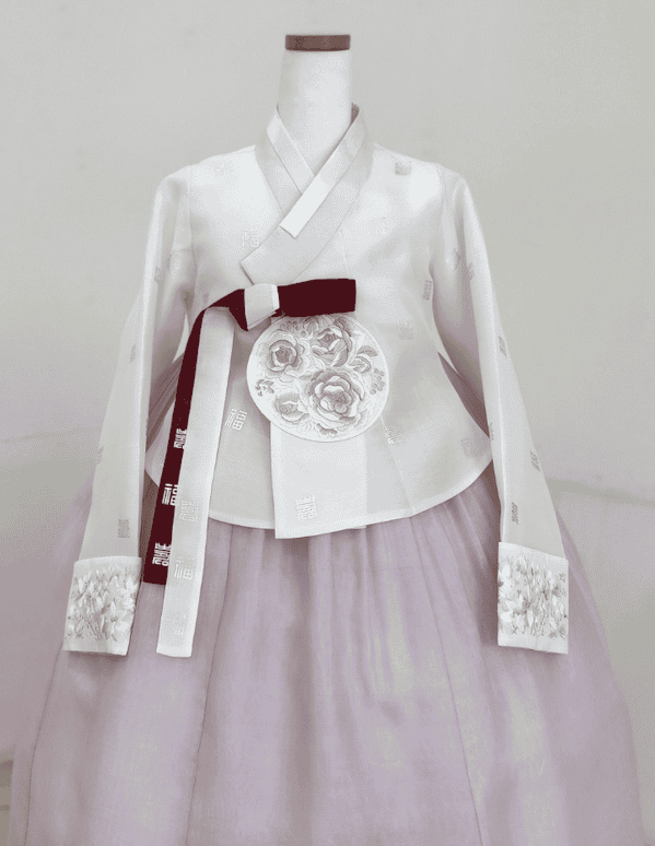 Close-up of hanbok embroidery with floral and crane patterns.