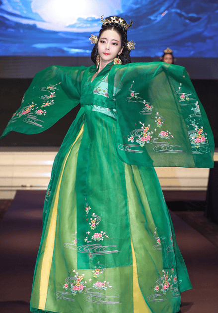 Models wearing modern hanbok-inspired outfits on a runway.