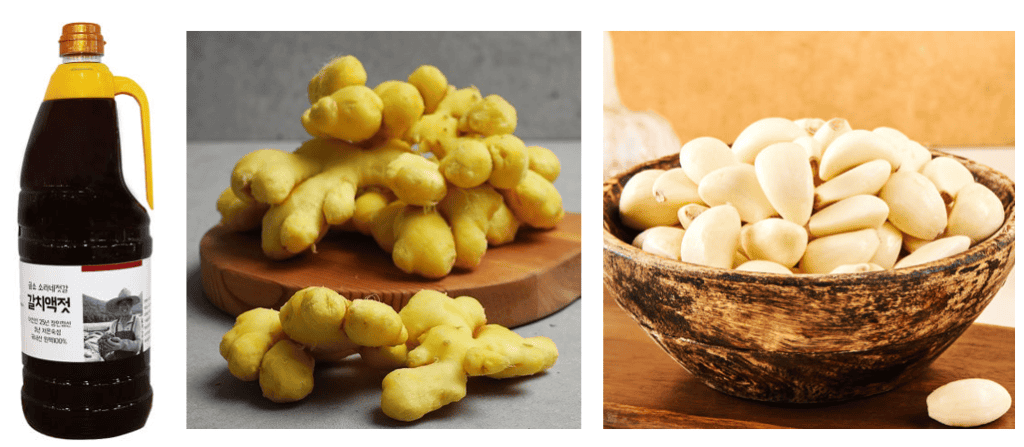 Garlic cloves, fresh ginger, and a small bottle of Korean fish sauce.