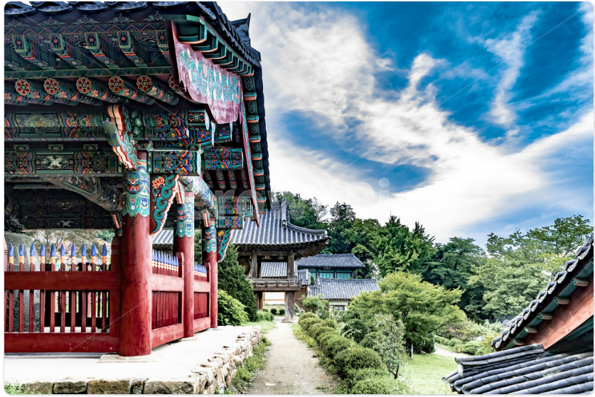 Close-up of colorful dancheong patterns on a Korean temple roof.