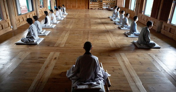 Travelers meditating during a Korean Temple Stay program.