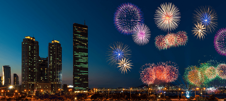 Crowds enjoying fireworks at a Korean festival.