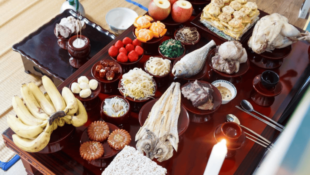 Traditional Korean Chuseok table with songpyeon rice cakes and fruits.