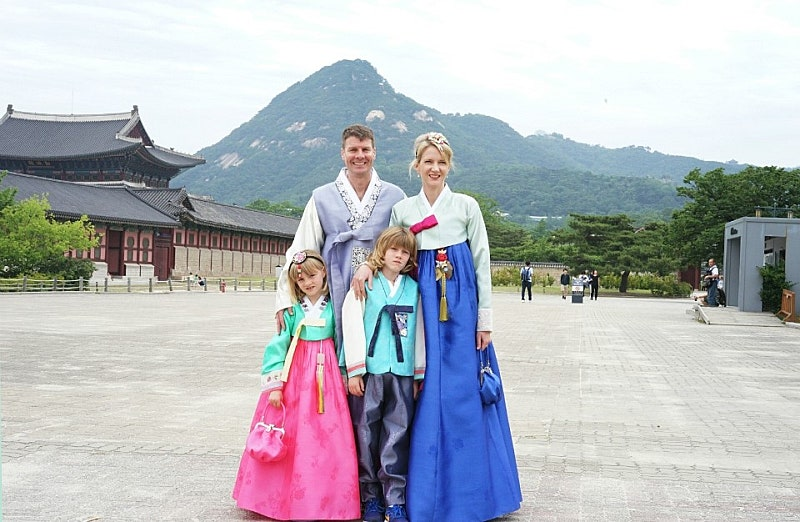 Tourists wearing hanbok at Gyeongbokgung Palace in Seoul.