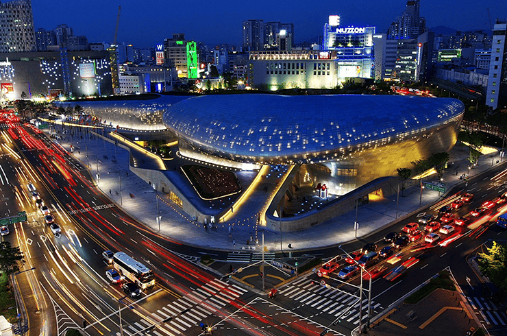 Futuristic view of Dongdaemun Design Plaza (DDP) at night.