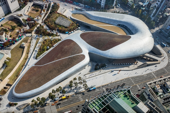Futuristic view of Dongdaemun Design Plaza (DDP) at night.