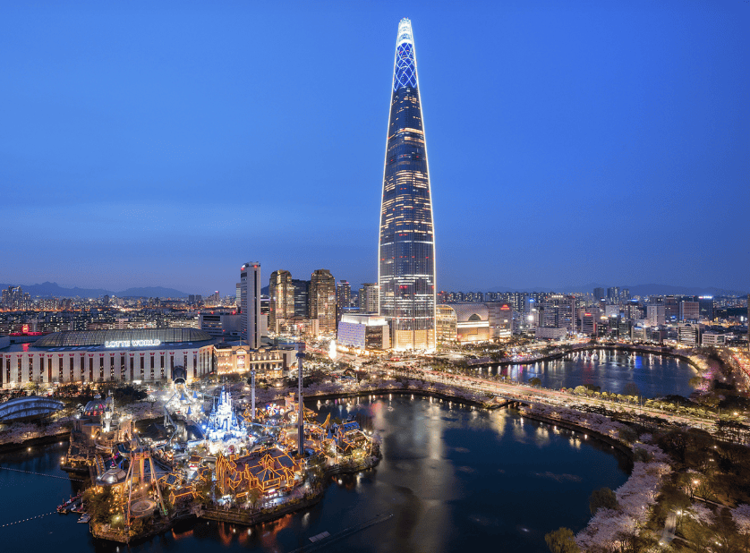 Night view of Lotte World Tower illuminated in Seoul’s skyline.