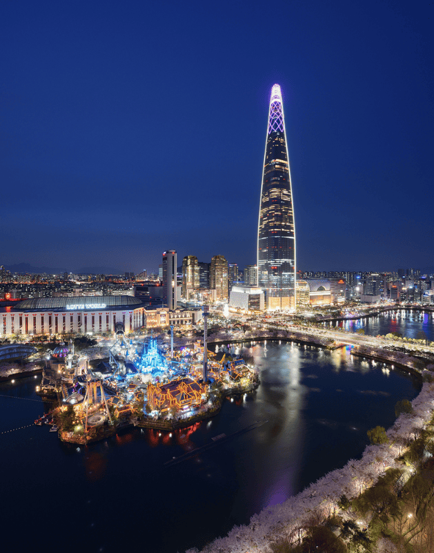 Night view of Lotte World Tower illuminated in Seoul’s skyline.