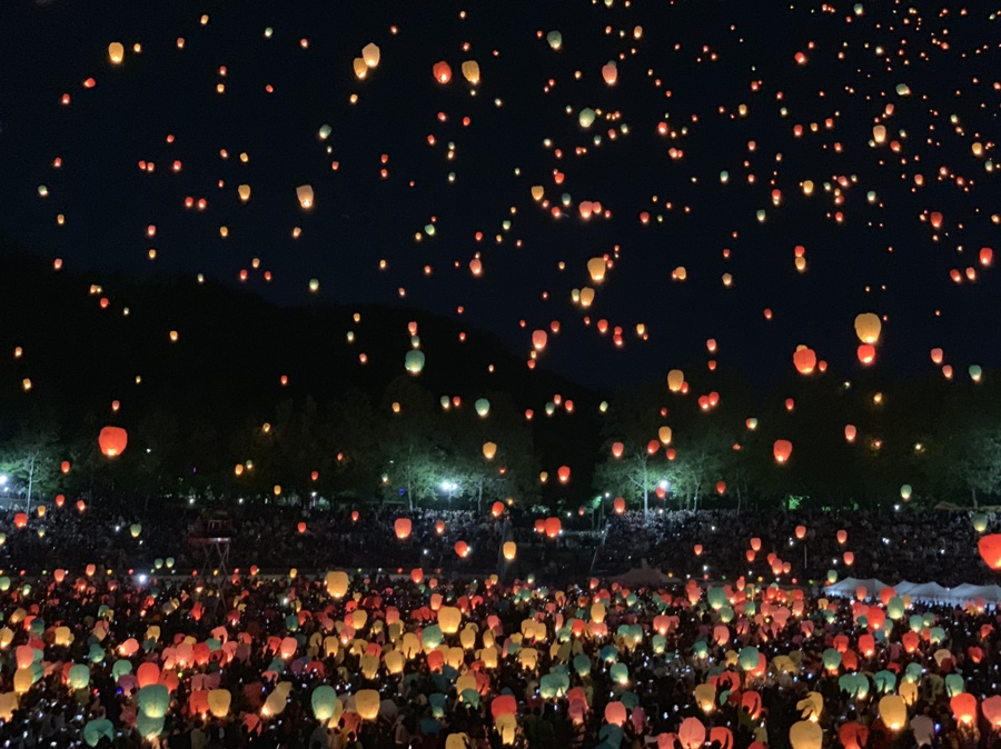 Lotus lanterns lighting up the night sky during a Korean festival.