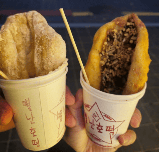A Korean hotteok pancake cut open, showing sweet syrup filling.
