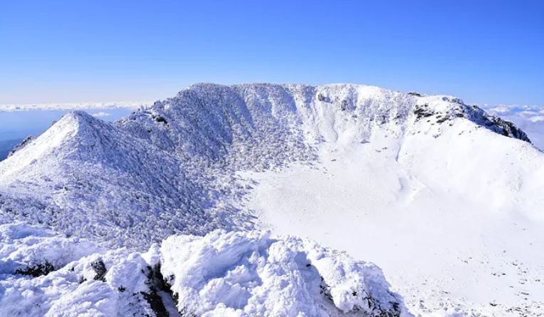 Snow-covered Baengnokdam crater lake on Hallasan Mountain in Jeju Island, South Korea