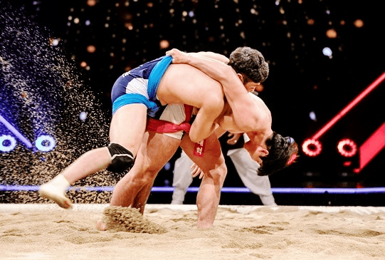 Two Korean wrestlers competing in a traditional ssireum match.
