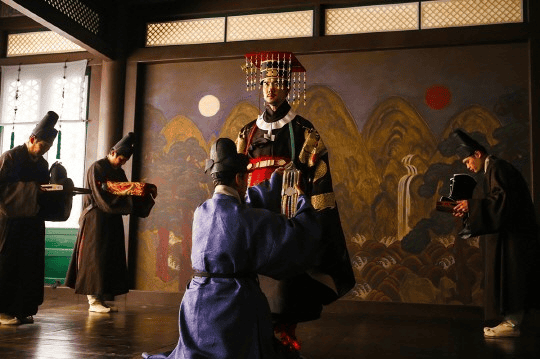Actors in Joseon-era costumes filming a Korean historical drama