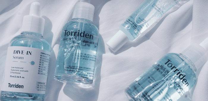 Torriden Dive-In Serum blue bottle on minimal background