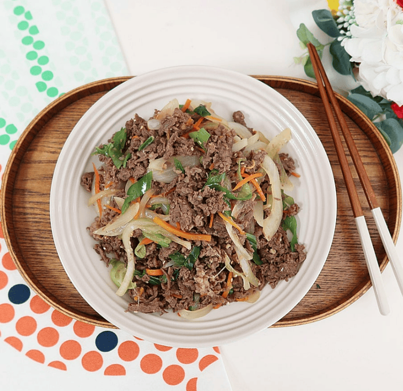 Korean bulgogi beef served with rice and vegetables.