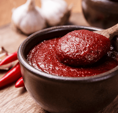 A small bowl of Korean gochujang chili paste.