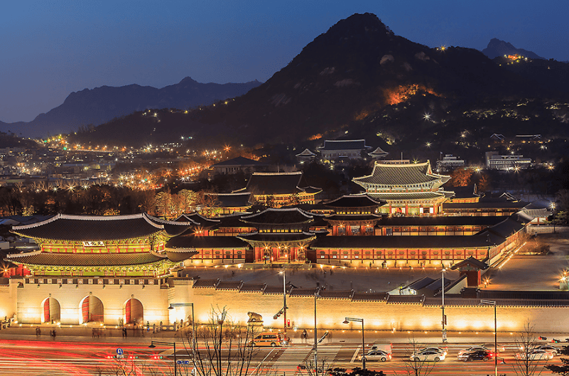 Night view of Gyeongbokgung Palace in Seoul with illuminated traditional architecture