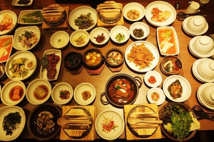 A traditional Korean family-style meal with rice, soup, and side dishes.