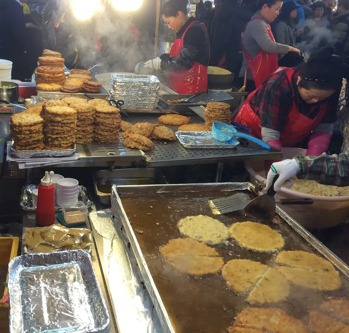 Frying bindaetteok at Gwangjang Market