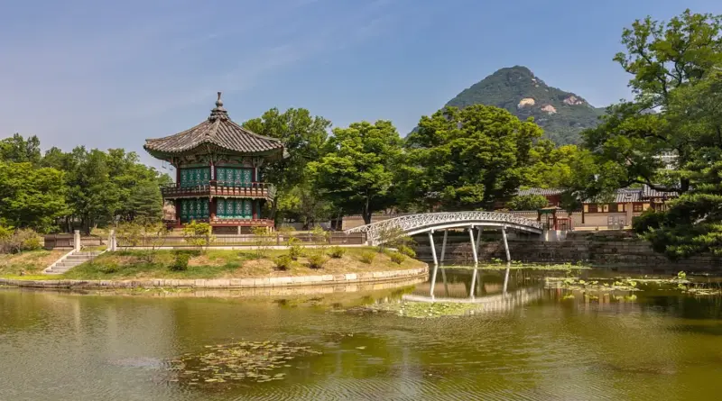 Hyangwonjeong Pavilion and Chwihyanggyo Bridge at Gyeongbokgung Palace with blue sky in Seoul
