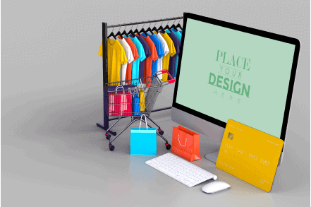 Brightly colored T-shirts displayed on a clothing rack with shopping bags, a computer monitor, and credit cards showcasing custom printing services at K&W Printing for apparel and merchandise customization.