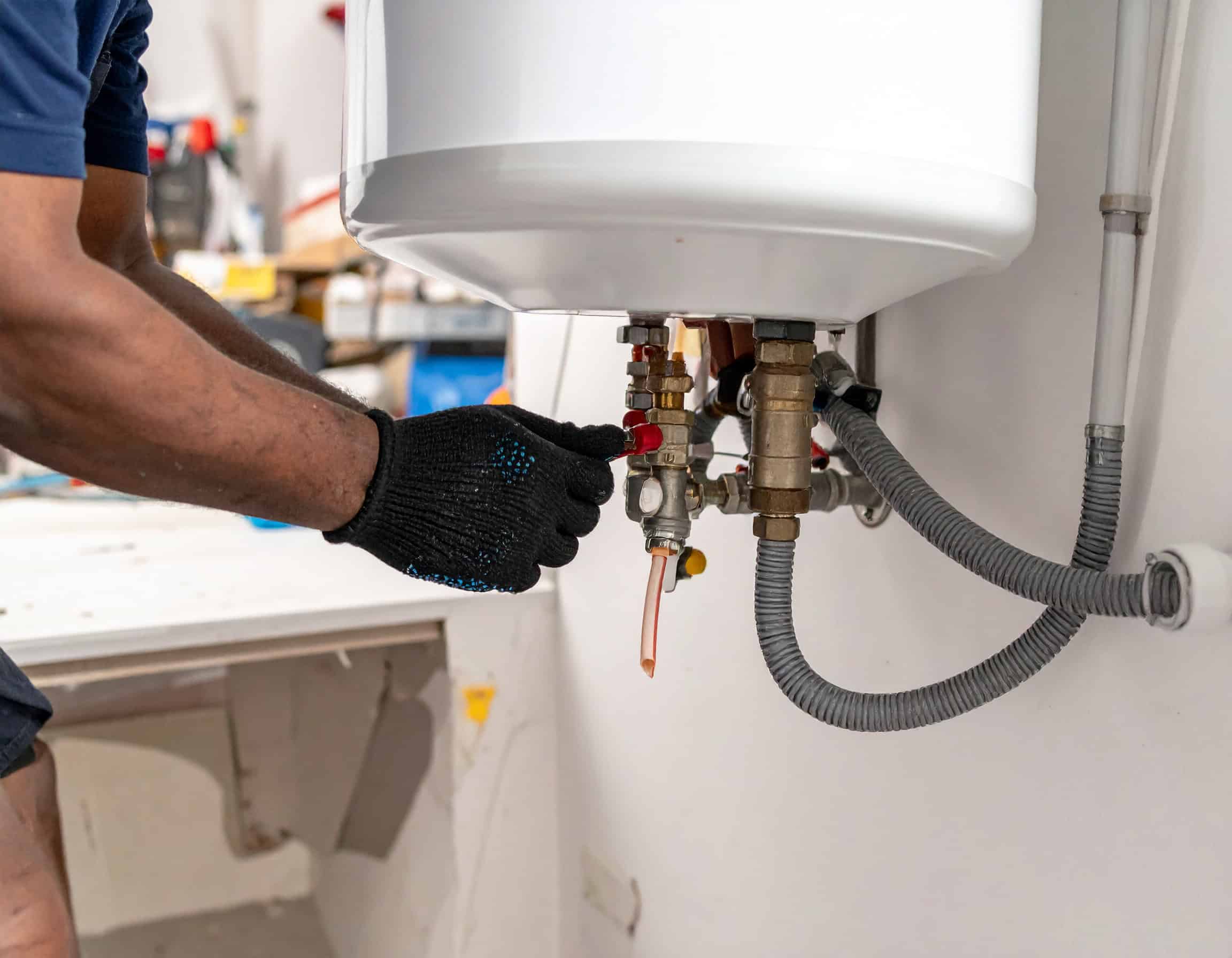 Technician-Repairing-Wall-Mounted-Water-Heater-Valves