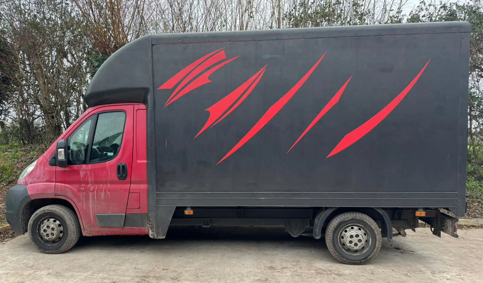 Laudera House Clearance's van photographed from the side.