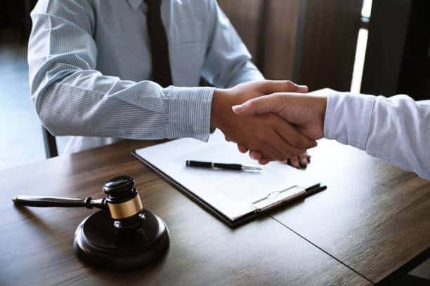 a close-up of a man shaking hands