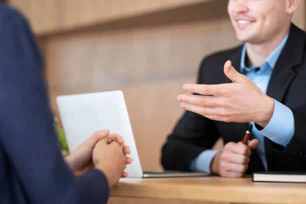 a man talking to a woman