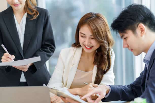 Group of young Asian business people with the creative work, talk and exchange ideas shared at the meeting.