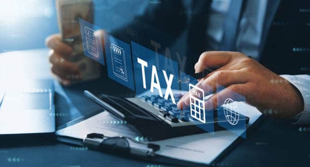Expert Income Tax Lawyers: Solutions for Complex Tax Issues 1 Business person fill in the income tax return form for payment. Financial research,government taxes and calculation tax return concept