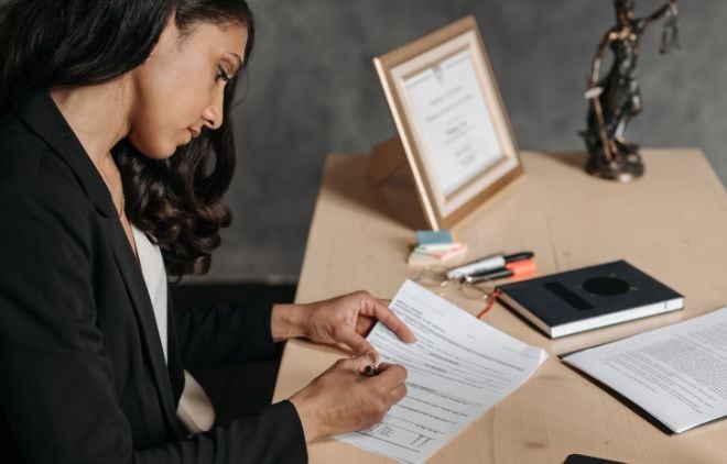 Woman signing documents