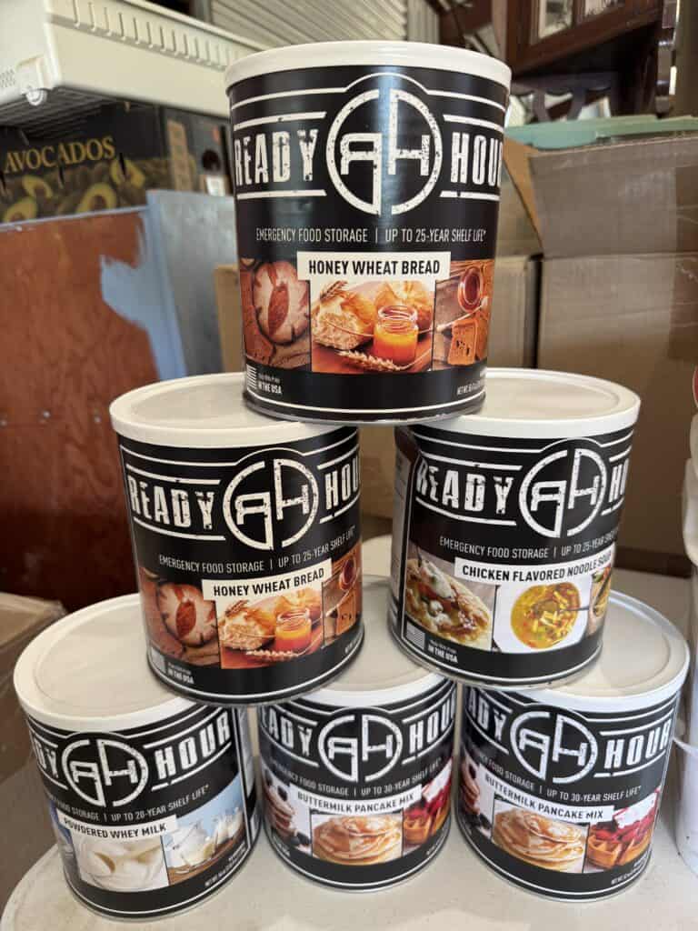 Emergency food storage cans with honey wheat bread for long-term preparedness.