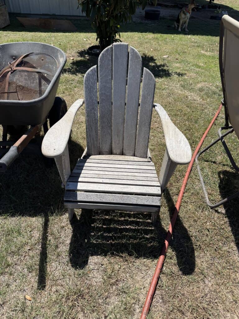 Adirondack wooden chair for outdoor use, part of estate auction furniture collection.