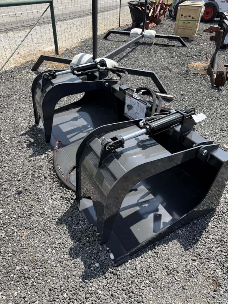 Large black heavy equipment bucket for sale at auction.