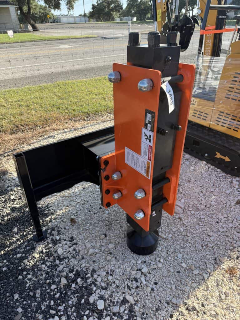 Orange heavy equipment attachment with hydraulic components for sale.