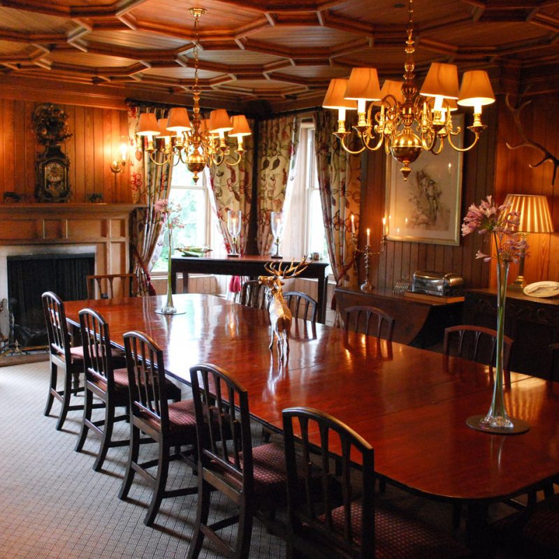 Dining room and fireplace in Letterewe Lodge