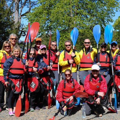 Team kayaking in Scotland