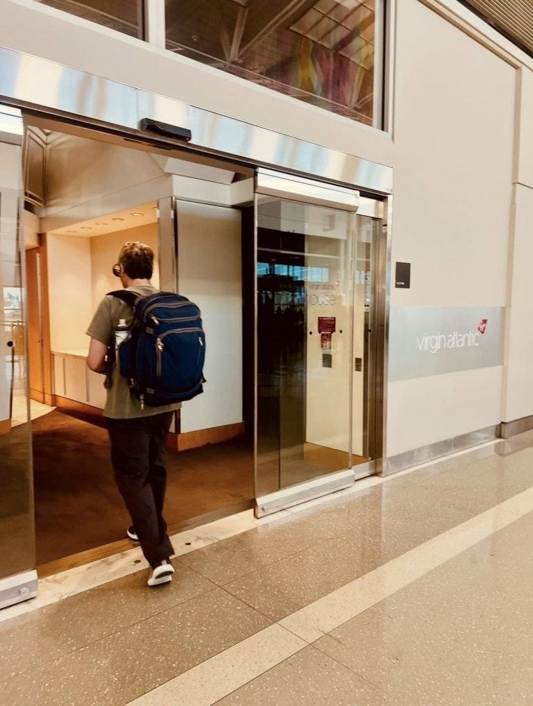 Travelers arriving at Virginia Atlantic airport with backpacks.