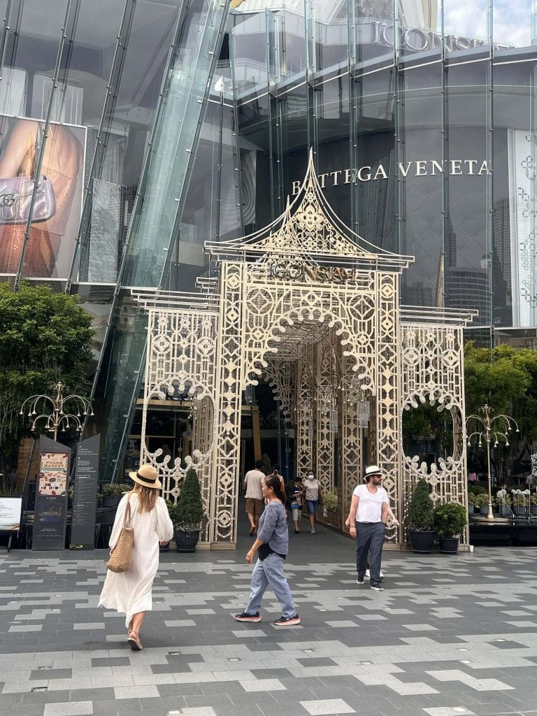 Bottega Veneta boutique entrance with ornate gate in a modern shopping mall.