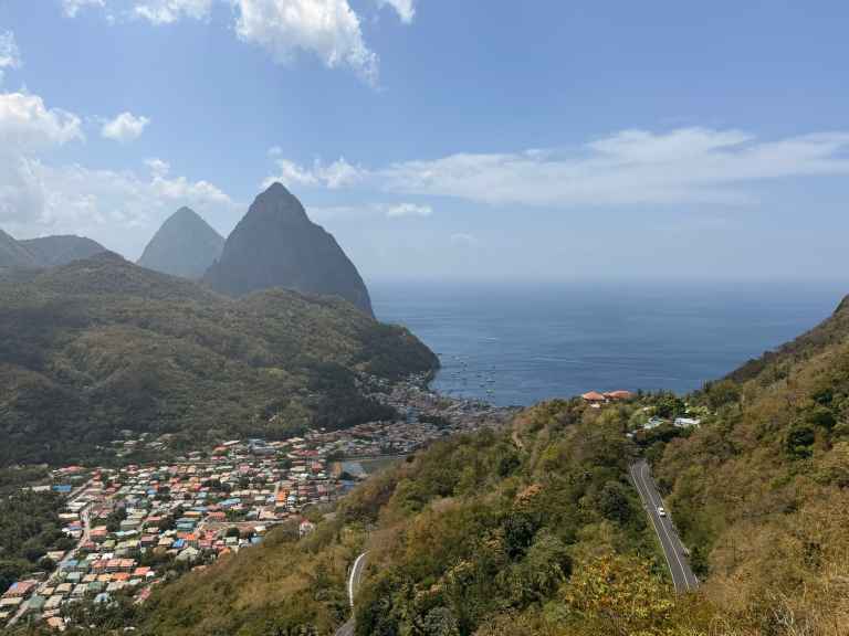 Scenic mountain landscape with lush forests overlooking the Caribbean Sea in Saint Lucia.