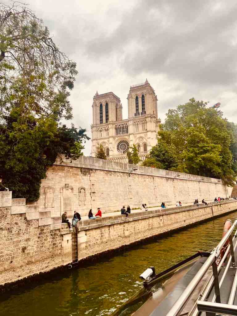 Notre-Dame Cathedral, Paris, historic landmark, Seine River, tourism.