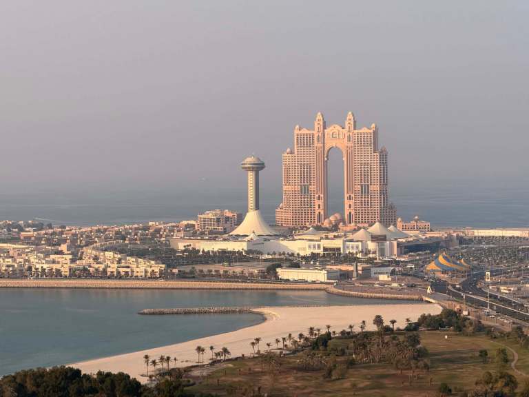 Dubai skyline with iconic Atlantis hotel and observation tower.