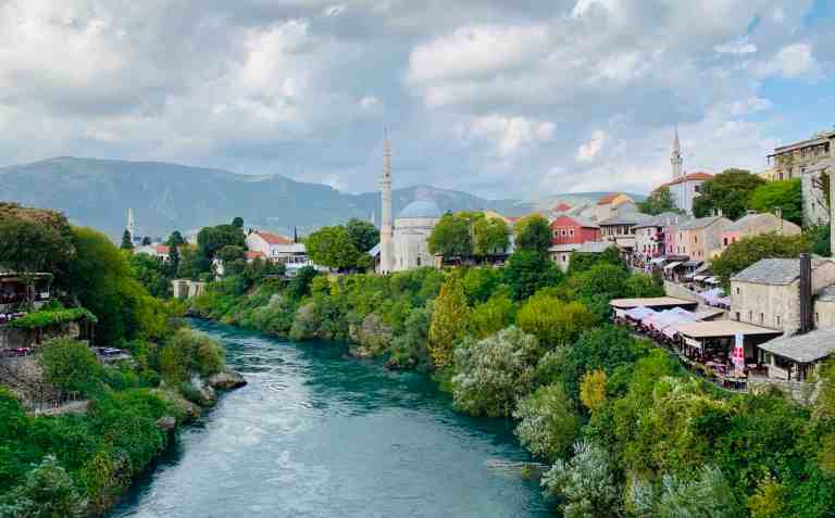 Beautiful riverside town with mosques and colorful buildings in Albania.