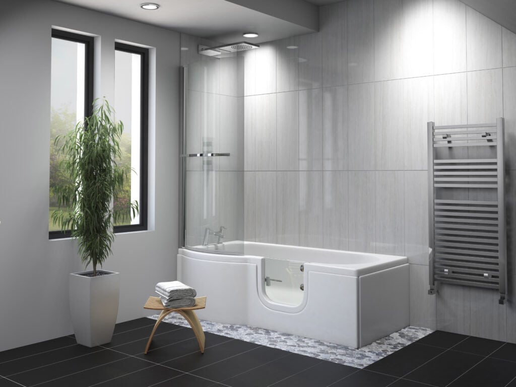 Stylish accessible washroom with walk-in bath, overhead shower, glass door, heated towel rail, and natural light from vertical windows.