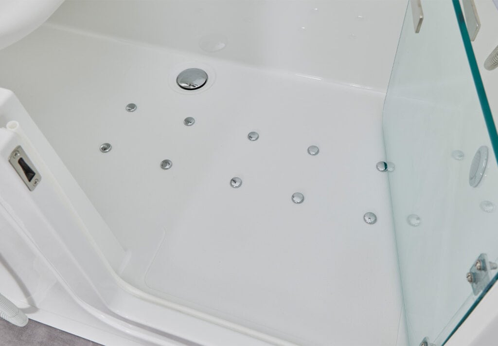 zoomed in preview of the base of Venezia walk in bath. showing anti-slip and drainage features