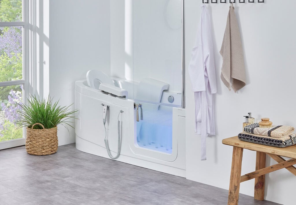 The Venezia (Easy Riser) walk-in bath features a sleek, speedboat-inspired design and an electronically controlled seat filled with water to almost the very top